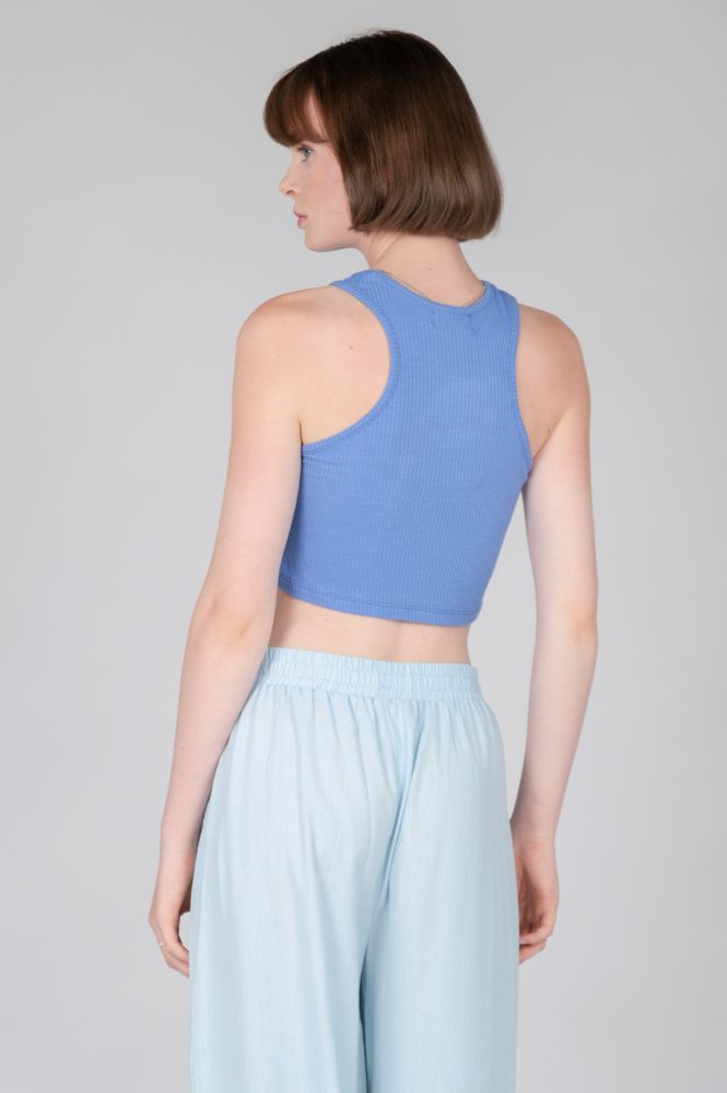 Soft ribbed racerback crop tank in pastel blue for modern activewear-inspired outfits and effortless off-duty style.