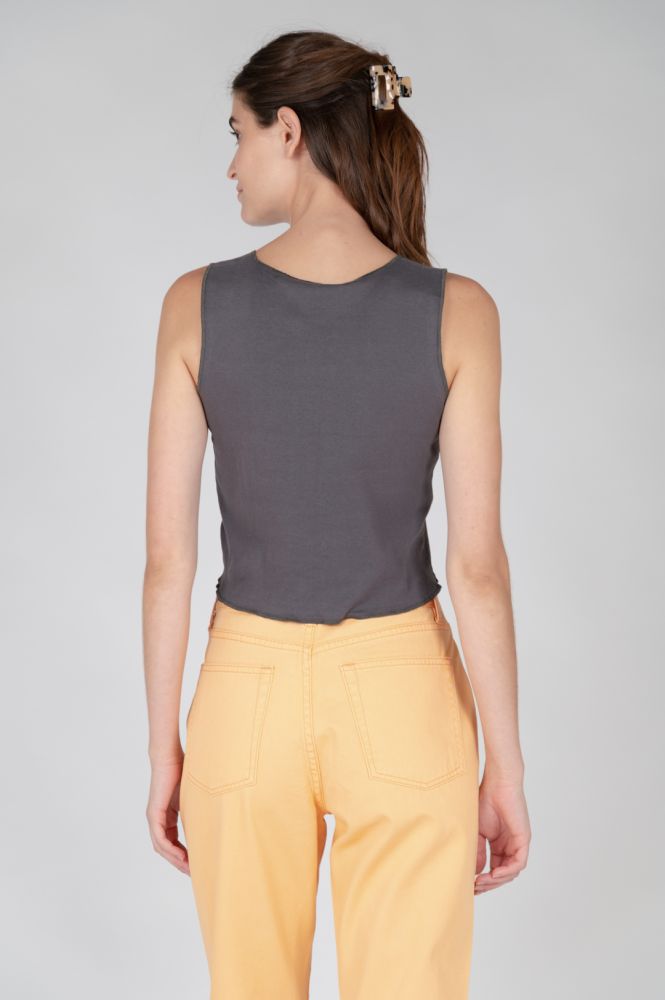 Fashion-forward graphic muscle tee with washed finish and cropped silhouette for modern casual and streetwear-inspired outfits.