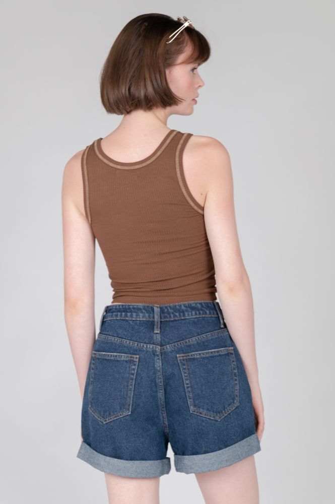 Chocolate brown sleeveless crop top with retro-inspired trim and modern comfort fit.