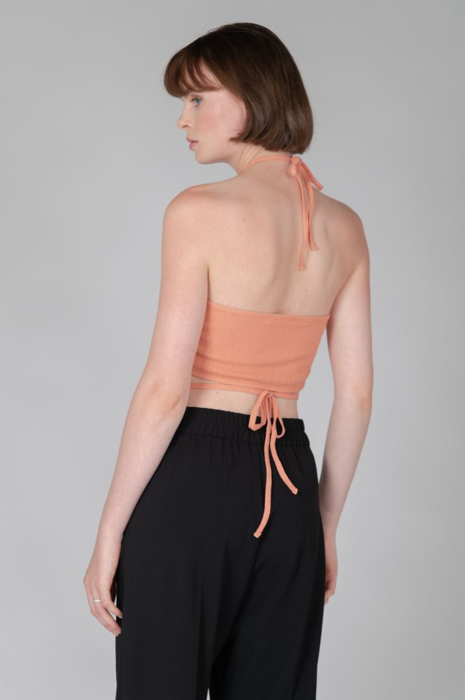 Stylish halter blouse with open waist design perfect for vacation and resort wear.