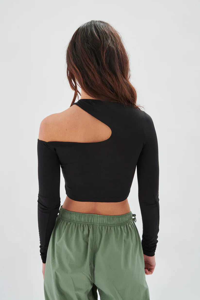 Stylish black asymmetrical blouse with cutout neckline and fitted silhouette for trendy boutique fashion looks.