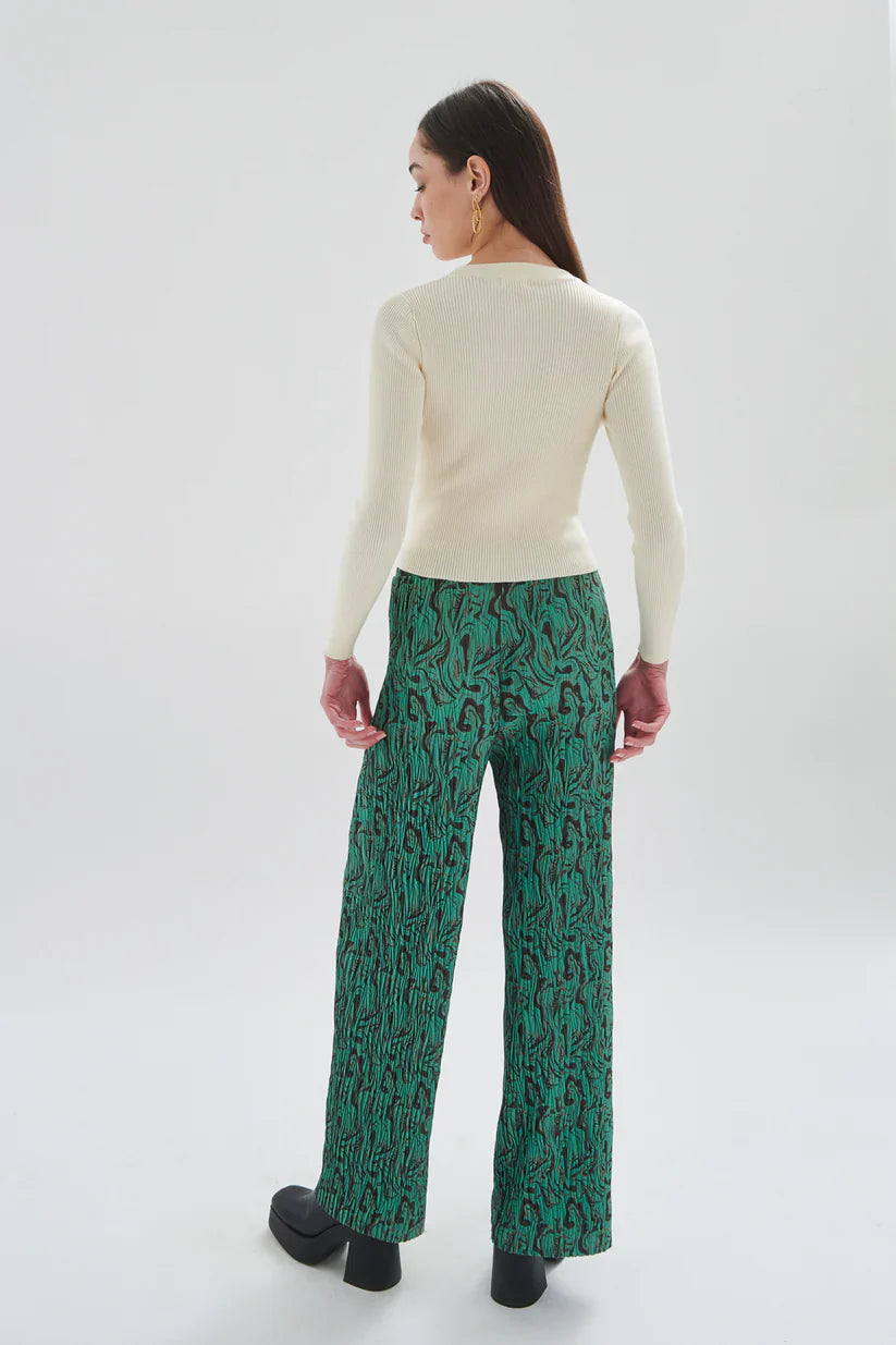 Elegant women’s printed trousers with fluid drape, bold swirl pattern, and tailored wide leg construction for chic outfits.