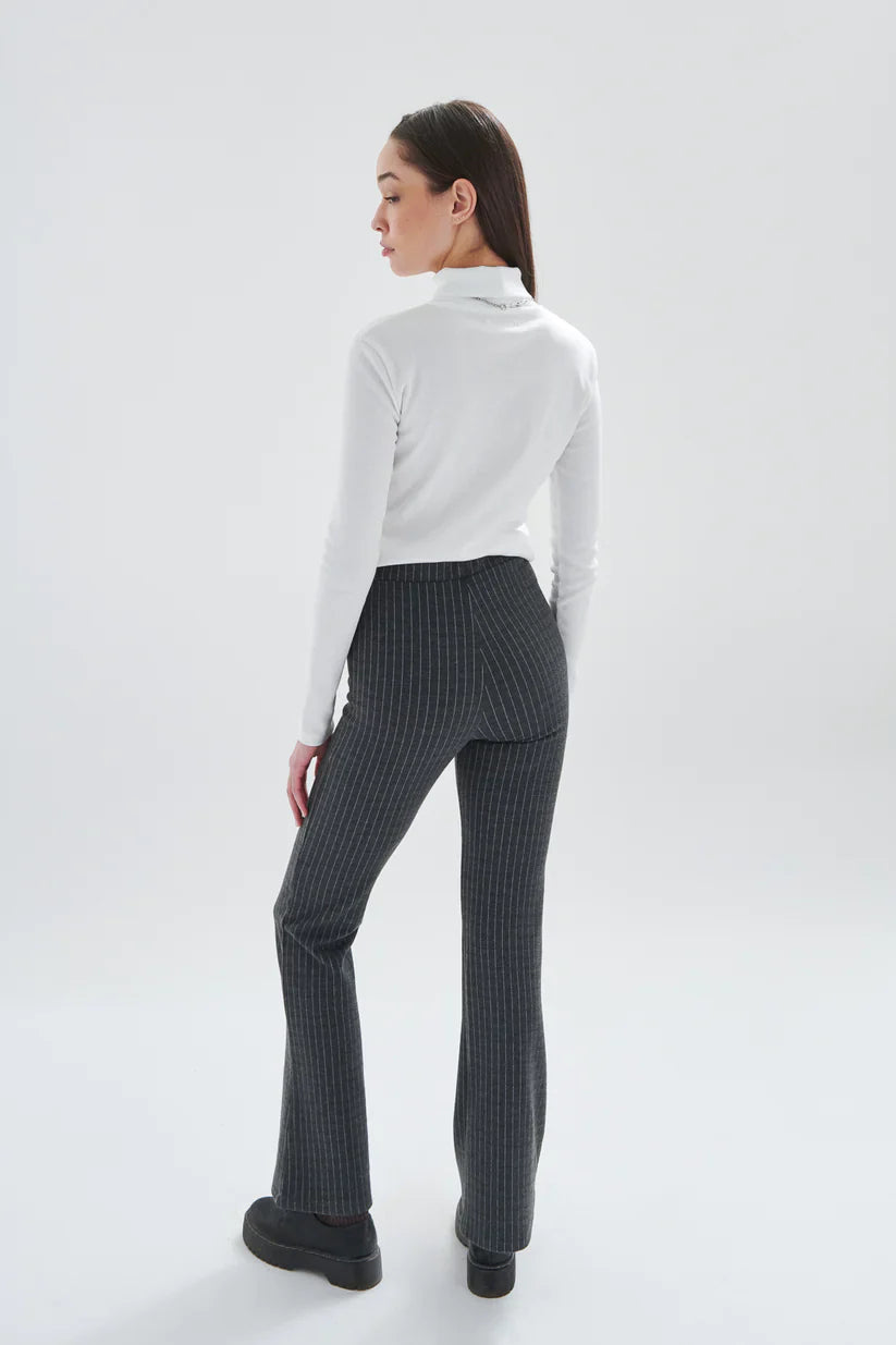 Chic women’s gray pinstripe pants with slim through hip fit and subtle flared hem for elevated styling and streetwear chic.