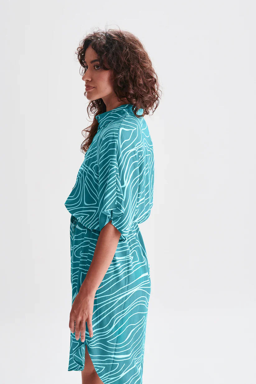 Women’s oversized teal shirt dress with modern line art print and drawstring waist for effortless chic looks.