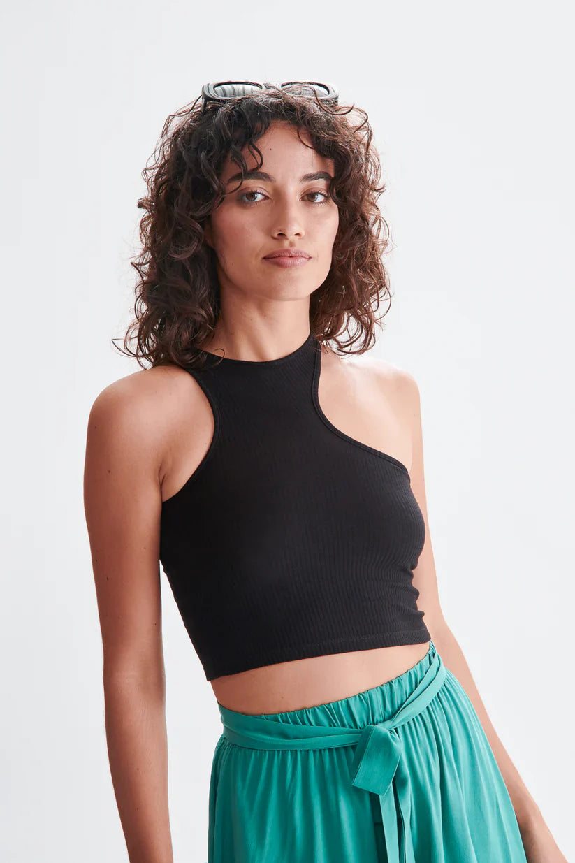 Fashion-forward black asymmetrical tank top with stretchy ribbed fabric and sleek contemporary aesthetic.
