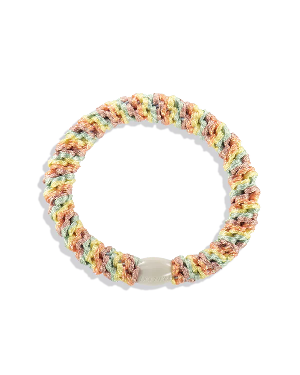 Stretch woven tutti frutti ponytail holder with soft braided fabric and secure flexible grip for thick, thin, or curly hair types.