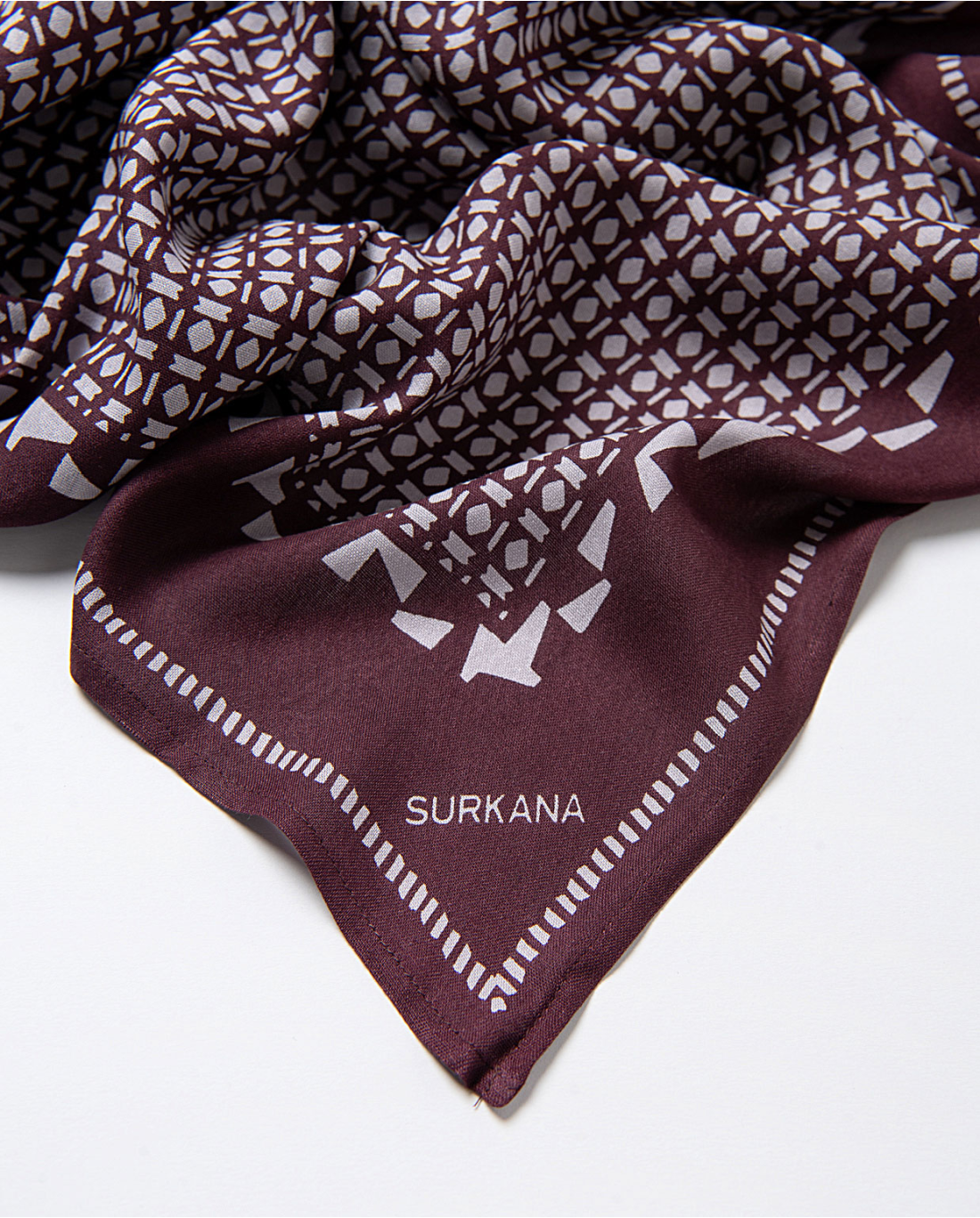 Modern eclectic scarf with handcrafted-inspired print and sophisticated layering energy