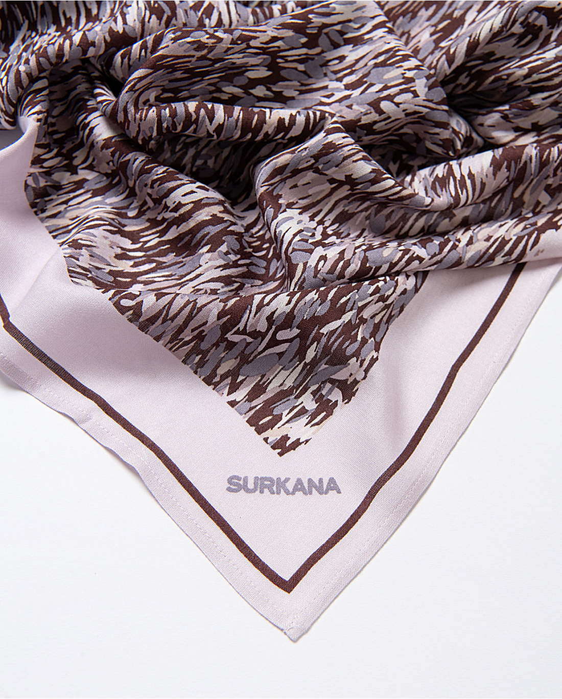 Romantic muted-tone scarf with fluid abstract detailing and contemporary boutique appeal