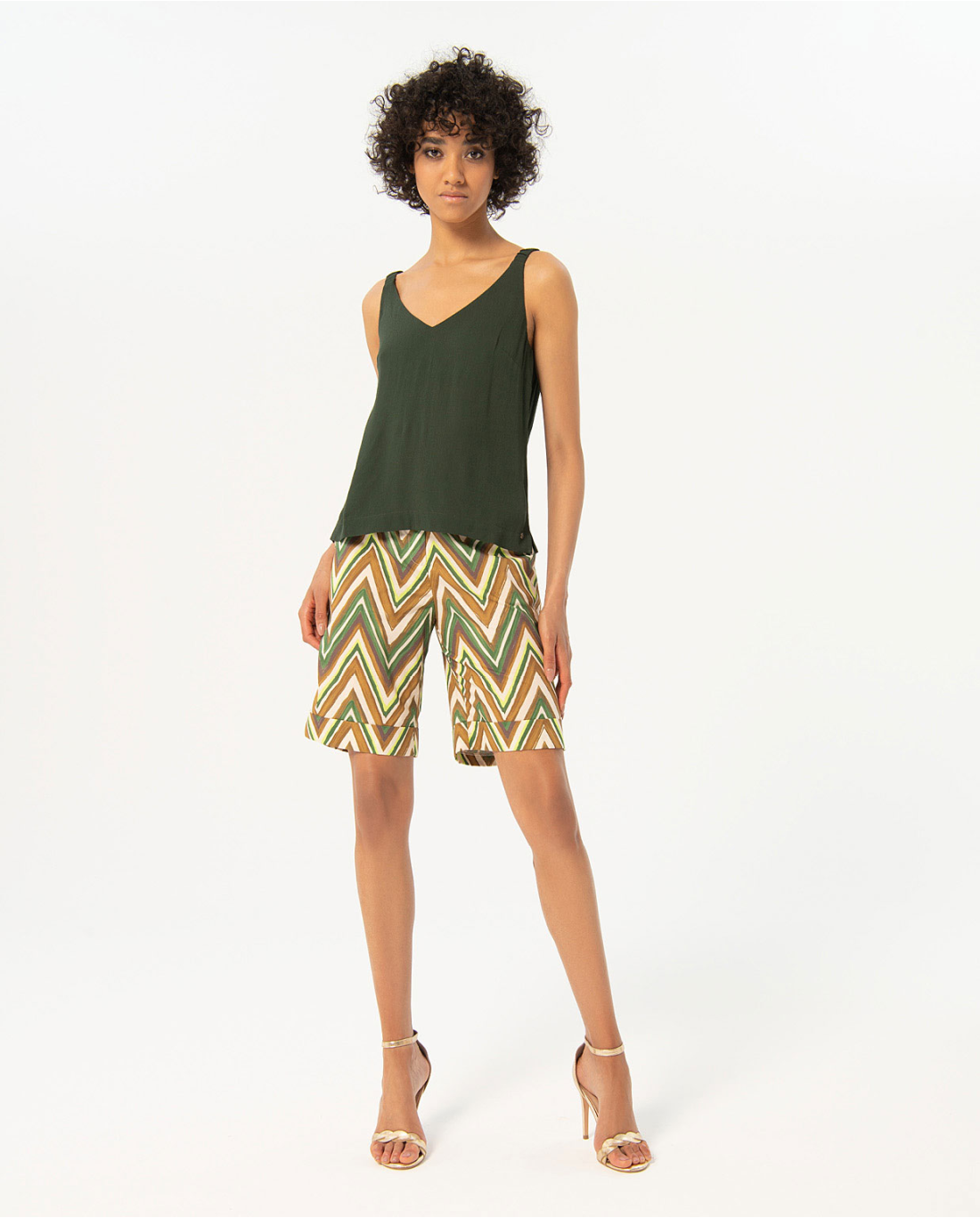 Fashion-forward olive green camisole top with airy relaxed fit and elegant neckline for effortless seasonal outfit pairing.