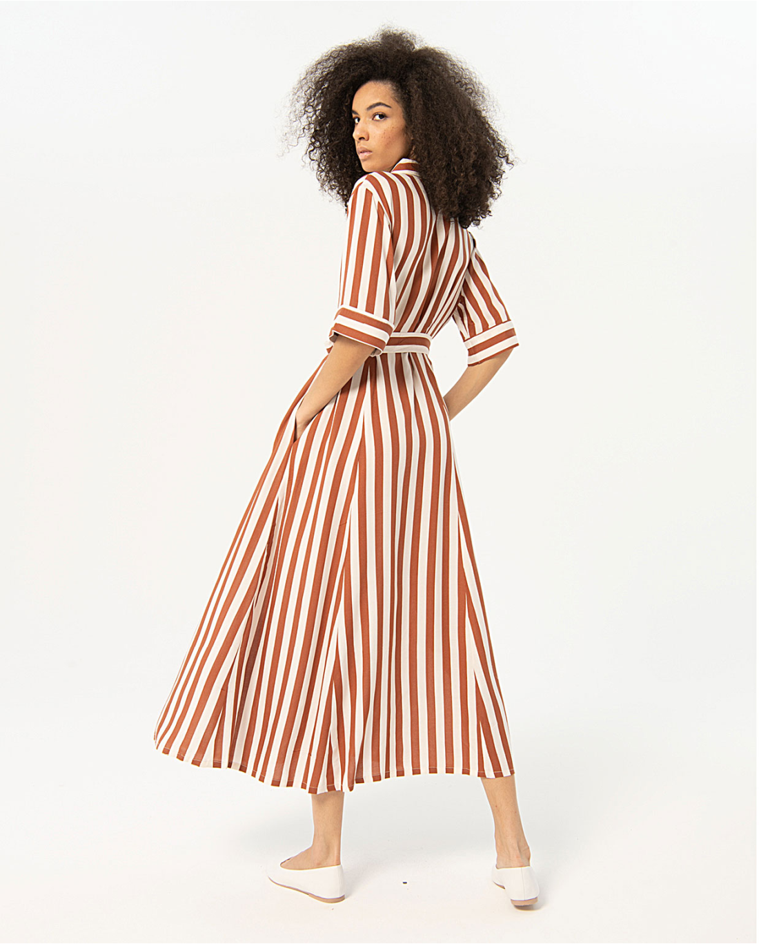 Casual luxe striped midi dress featuring tailored collar, side pockets, and belted waist for refined everyday summer fashion.