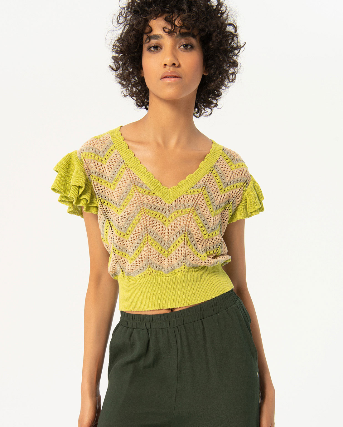 Chic dark green utility pants with adjustable ankle ties and soft draped fabric for modern off-duty fashion looks.