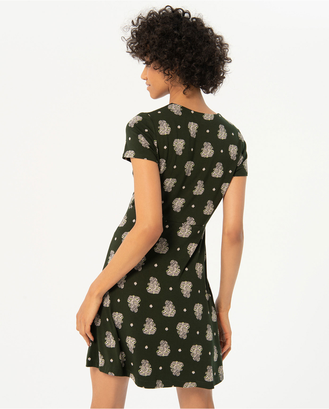 Fashion-forward olive green mini dress featuring tiny floral motifs and flattering tailored fit for everyday elegance.