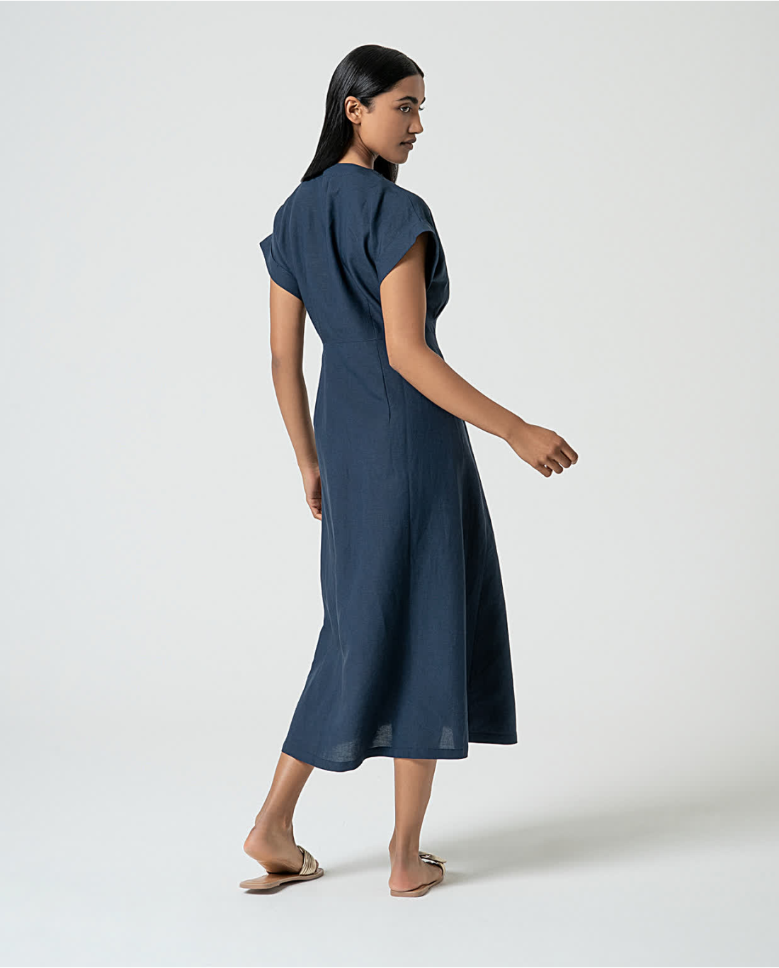 Lightweight navy summer dress with tailored seams and elevated minimalist boutique style.