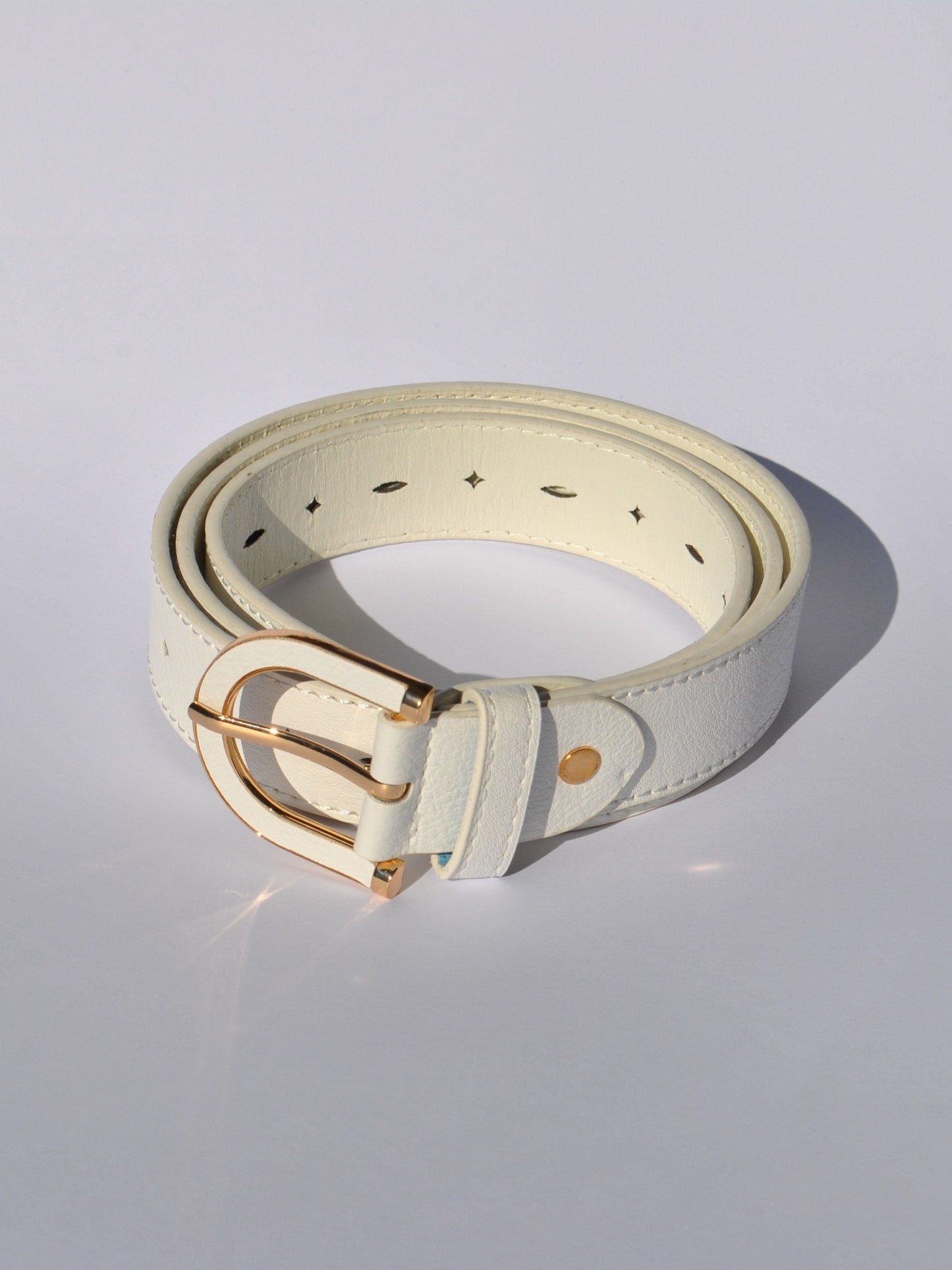 Women's adjustable faux leather belt with vibrant blue finish and polished gold hardware.