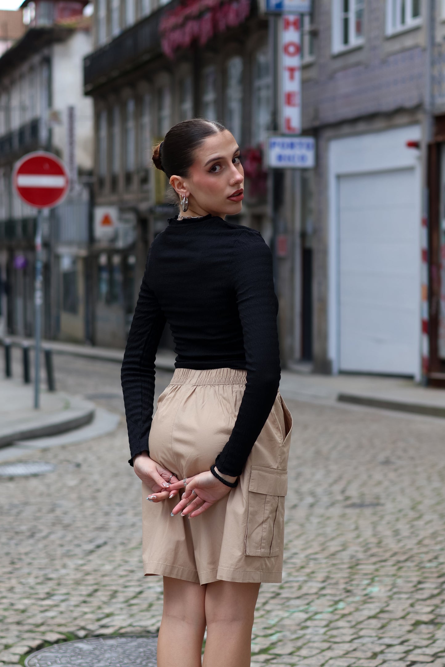 Women’s high-waisted cargo shorts with sleek utility styling and versatile capsule wardrobe aesthetic.