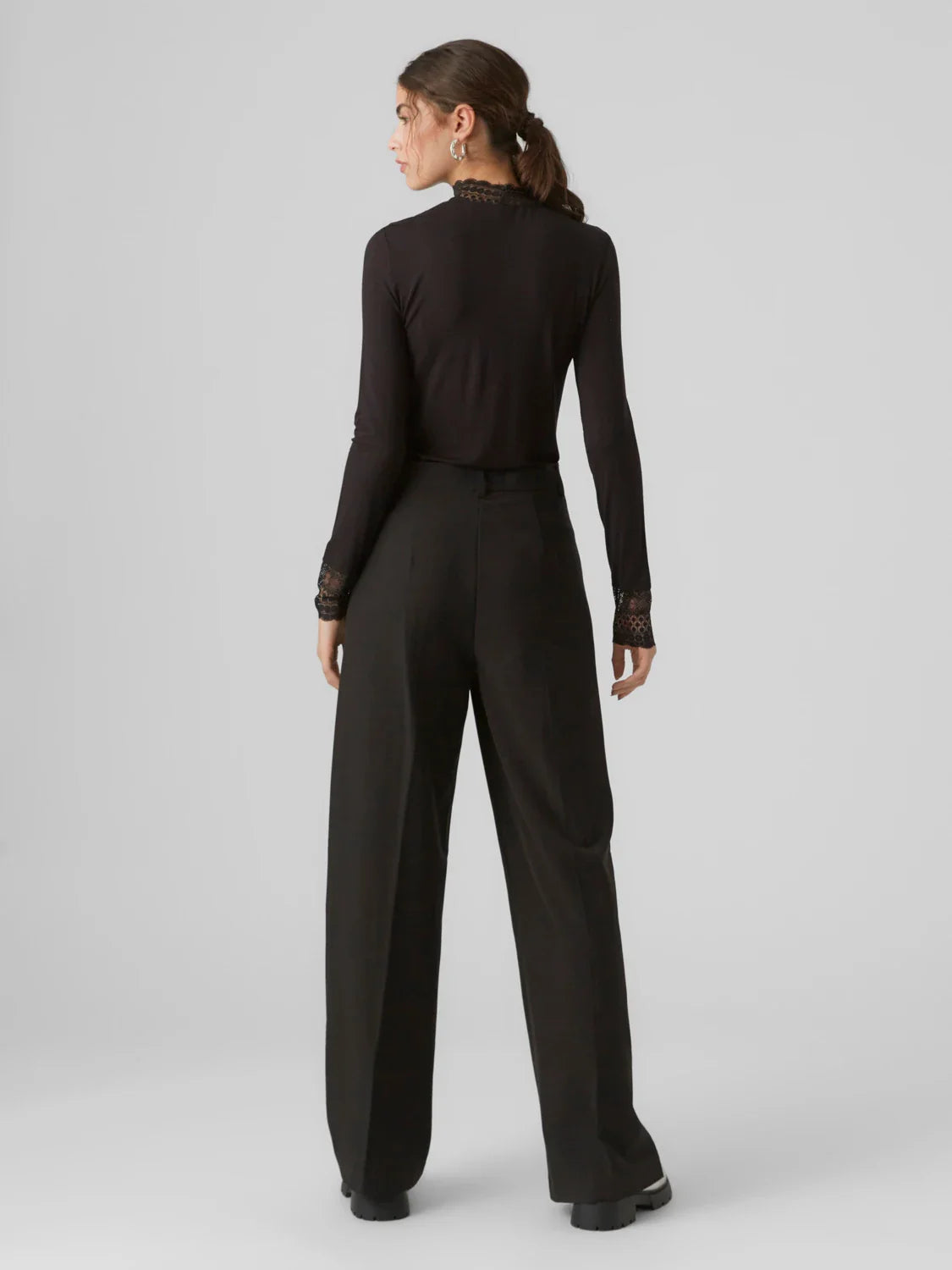 Sophisticated black lace mesh top with romantic detailing and sleek silhouette for elevated women’s fashion.