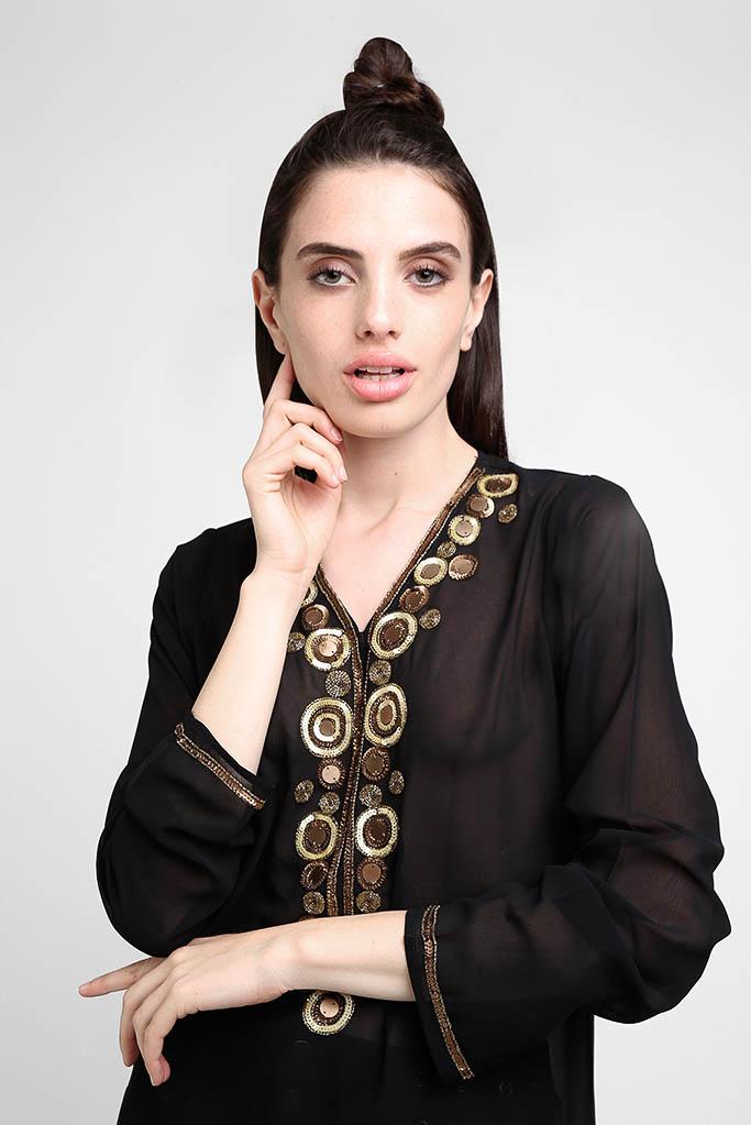 Sophisticated black tunic top with sheer sleeves and intricate handcrafted appearance.