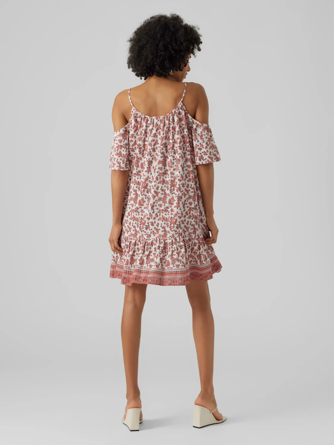 Women's breezy floral vacation dress with tassel accents and effortless resort wear appeal.