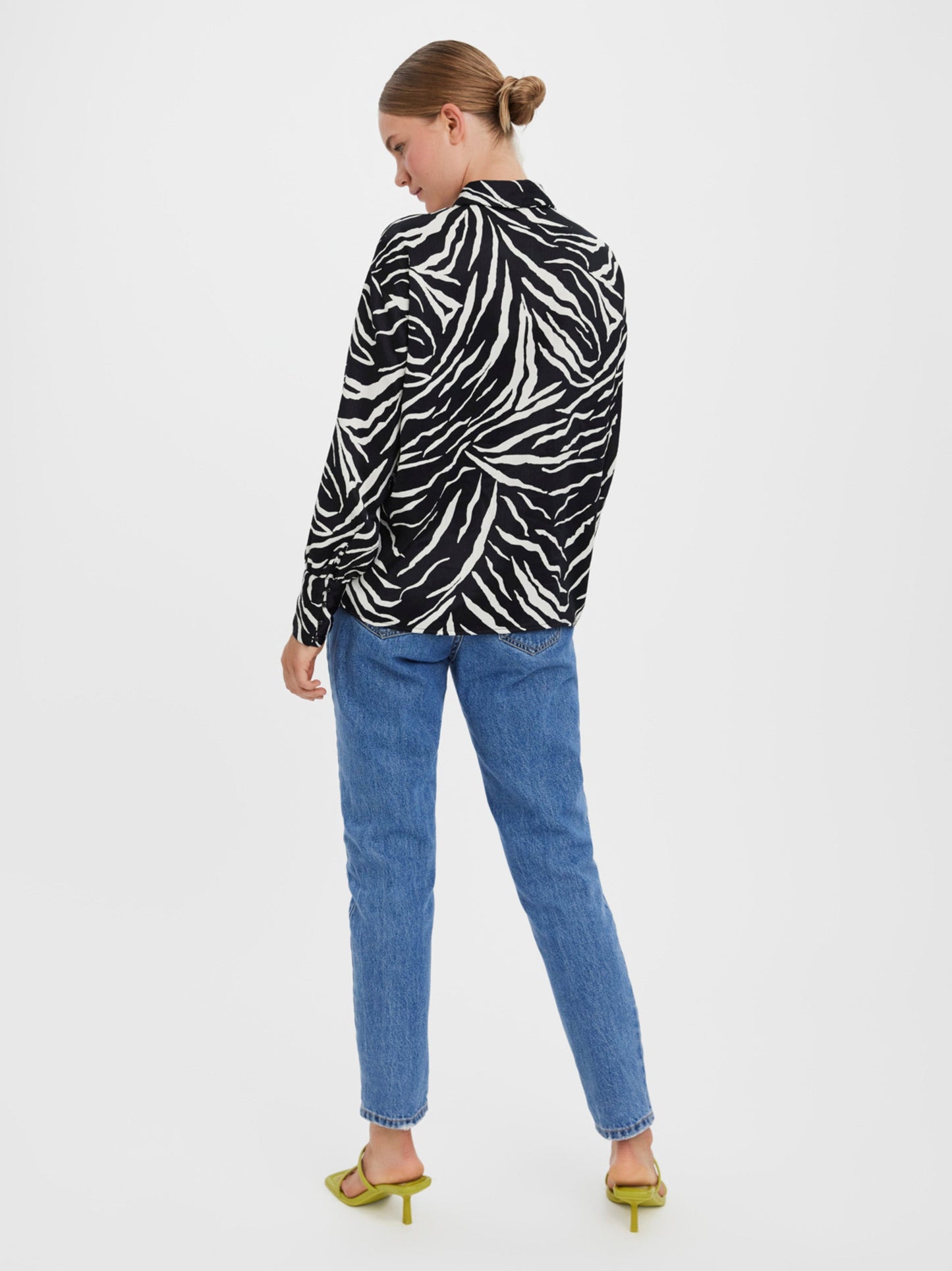 Women’s zebra print fashion blouse featuring bold black and white stripes and sophisticated tailored silhouette.