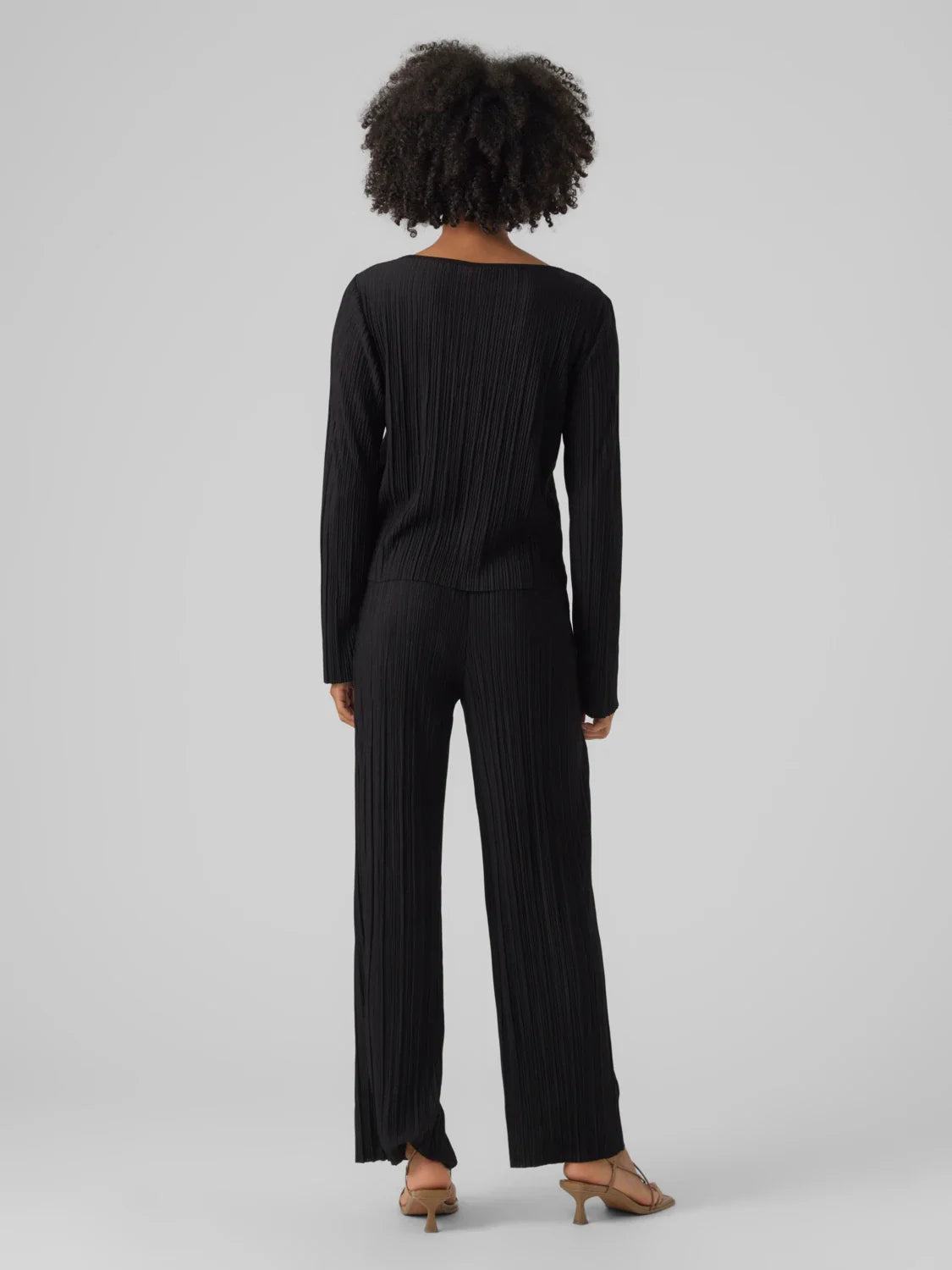 Women’s lightweight black pleated top featuring relaxed fit and polished minimalist wardrobe design.