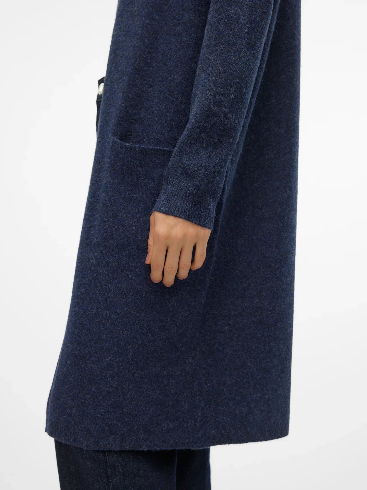 Sophisticated blue knit cardigan with long silhouette and elevated modern minimalist wardrobe styling.