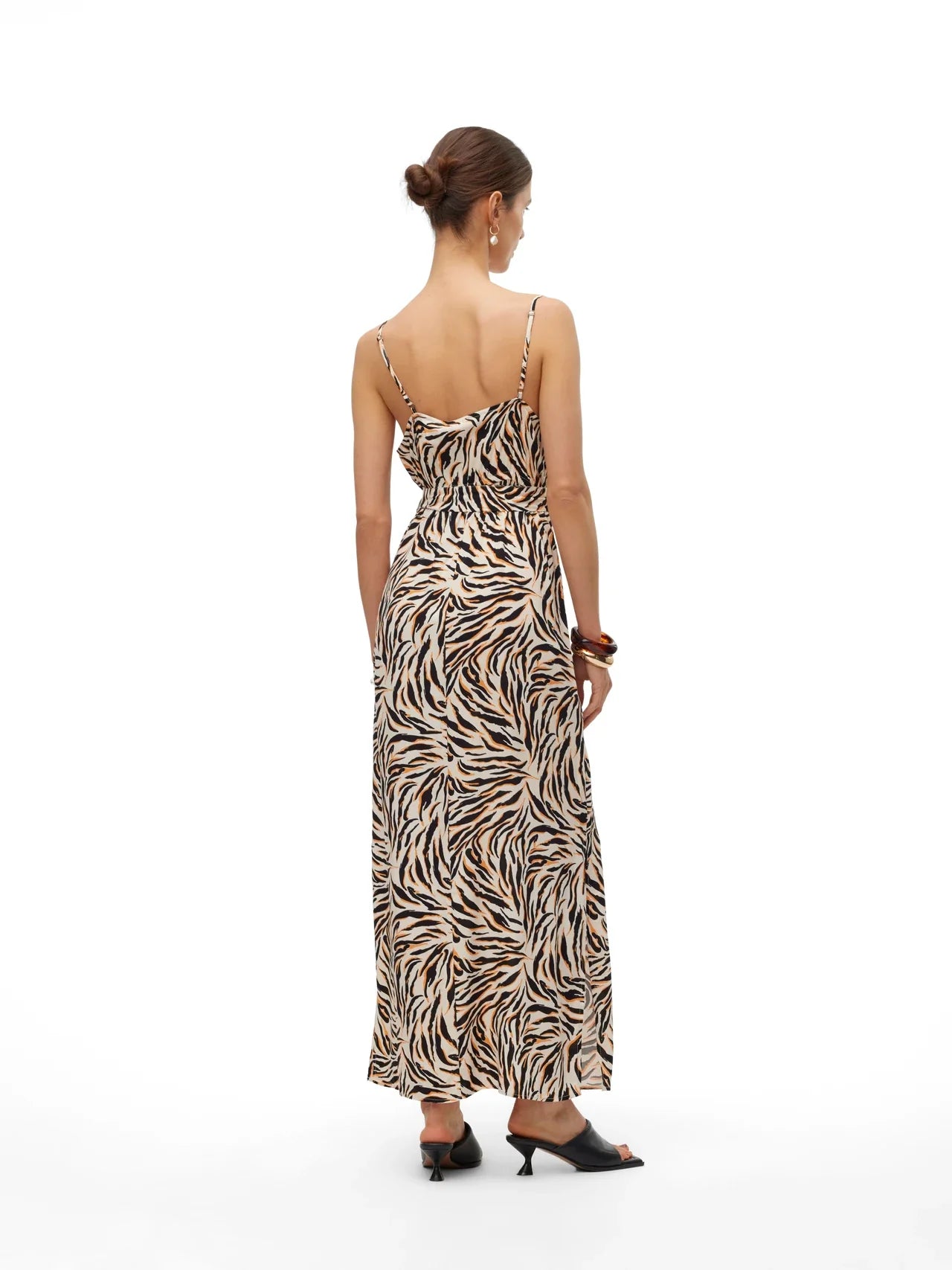 Resort-inspired maxi sundress with bold abstract animal print and flattering cinched waist detail.