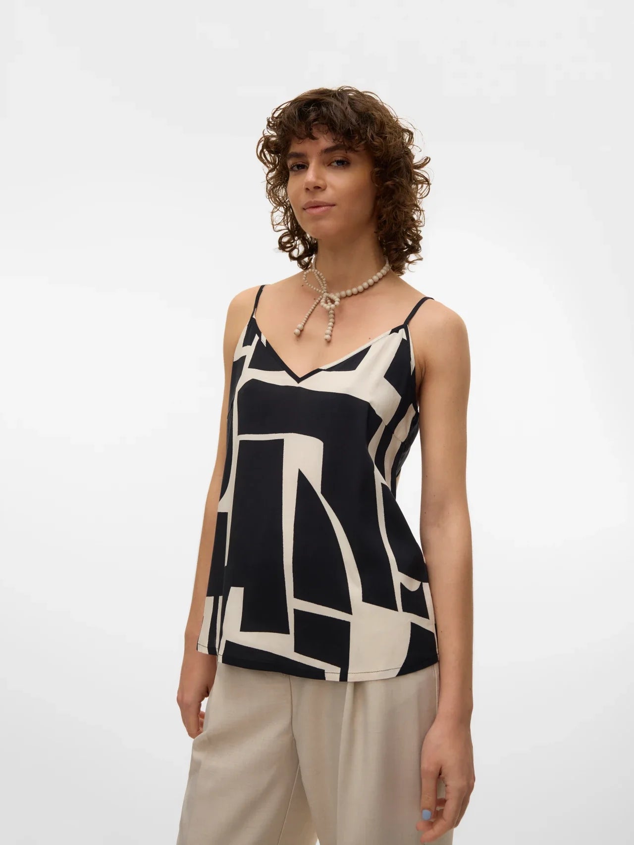 Lightweight geometric print camisole with modern artistic pattern and versatile everyday sophistication.