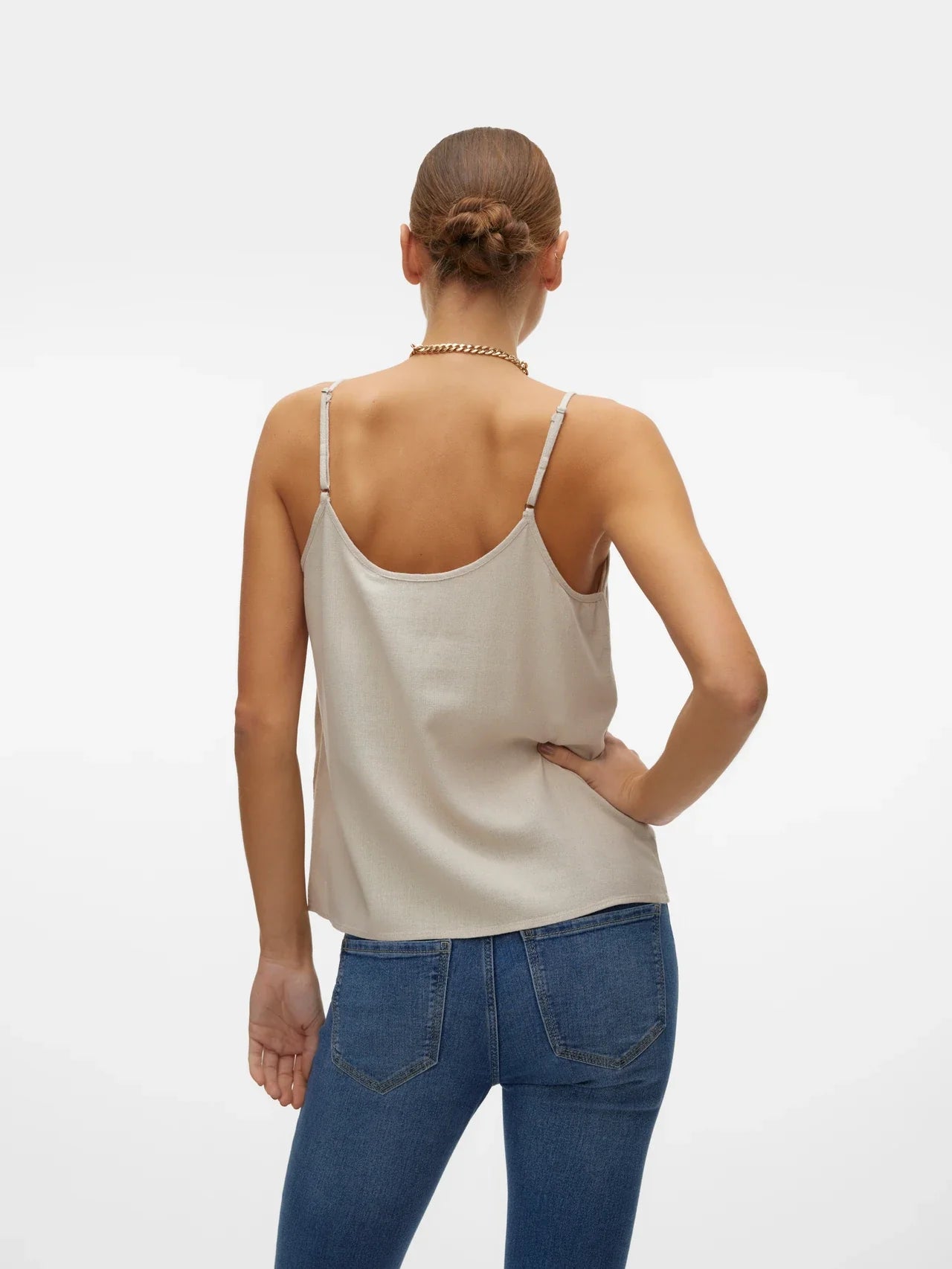 Elegant white summer cami top with fluid silhouette and minimalist Scandinavian-inspired boutique fashion style.