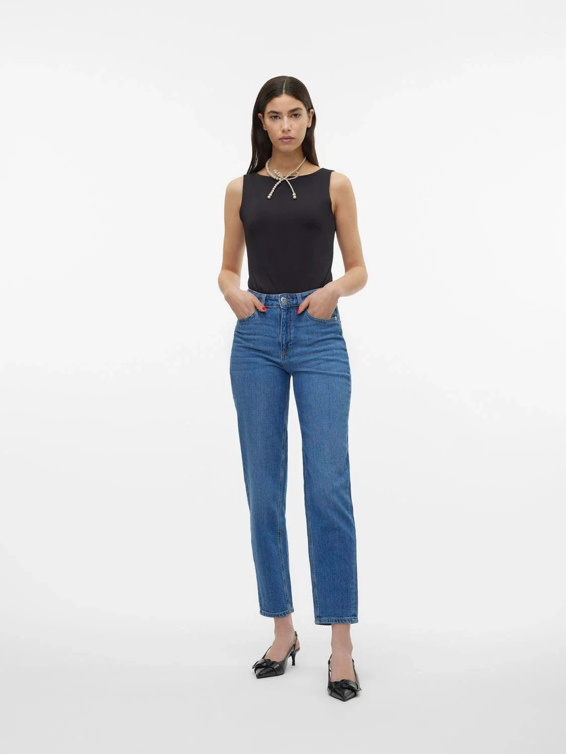 Trendy women’s slim straight denim jeans with medium wash finish and effortless street-style aesthetic.