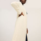 Cozy cream cardigan sweater with open front design and modern casual-chic aesthetic.