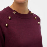 Women's wine red long-sleeve sweater featuring statement gold button details around the neckline for sophisticated casual styling.