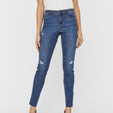 Blue skinny jeans for women featuring ripped knee details, stretch denim fabric, and flattering slim-fit design for modern street style.