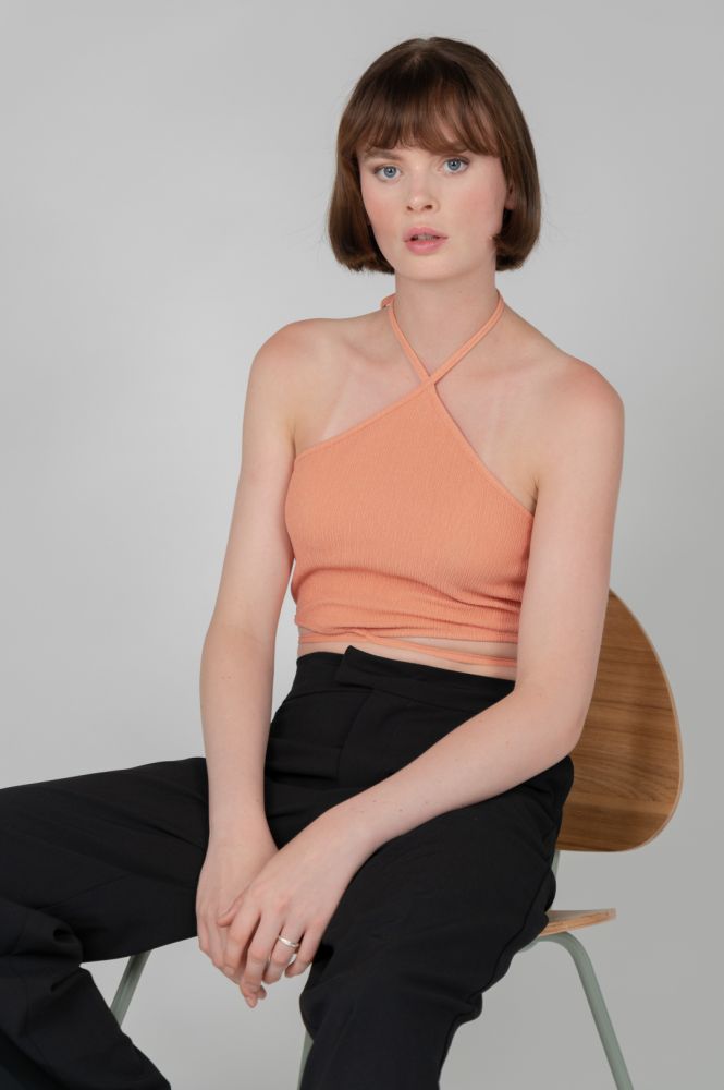 Trend-driven halter top perfect for summer events, vacations, and casual outings.