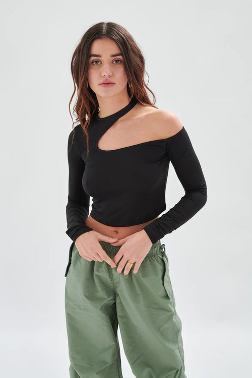 Chic black one-shoulder crop top featuring modern cutout neckline and sleek body-hugging fit for contemporary styling.