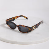 Elegant women's tortoise frame sunglasses featuring lightweight construction and modern designer-inspired styling.