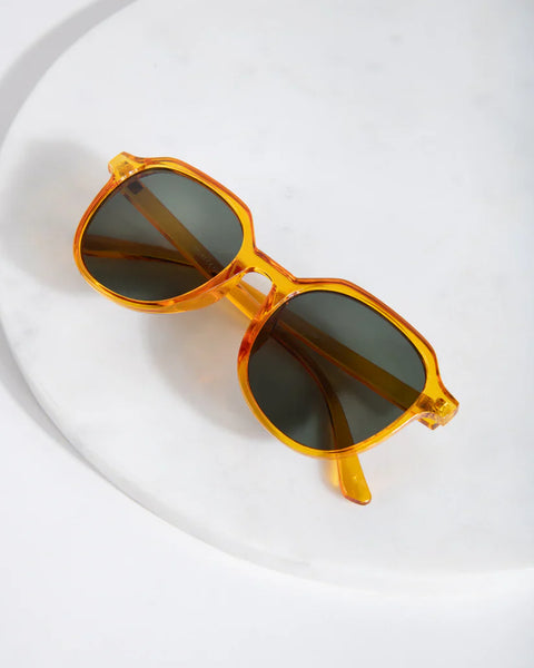 Minimalist designer-inspired sunglasses featuring lightweight translucent frames and modern cool-girl aesthetic.