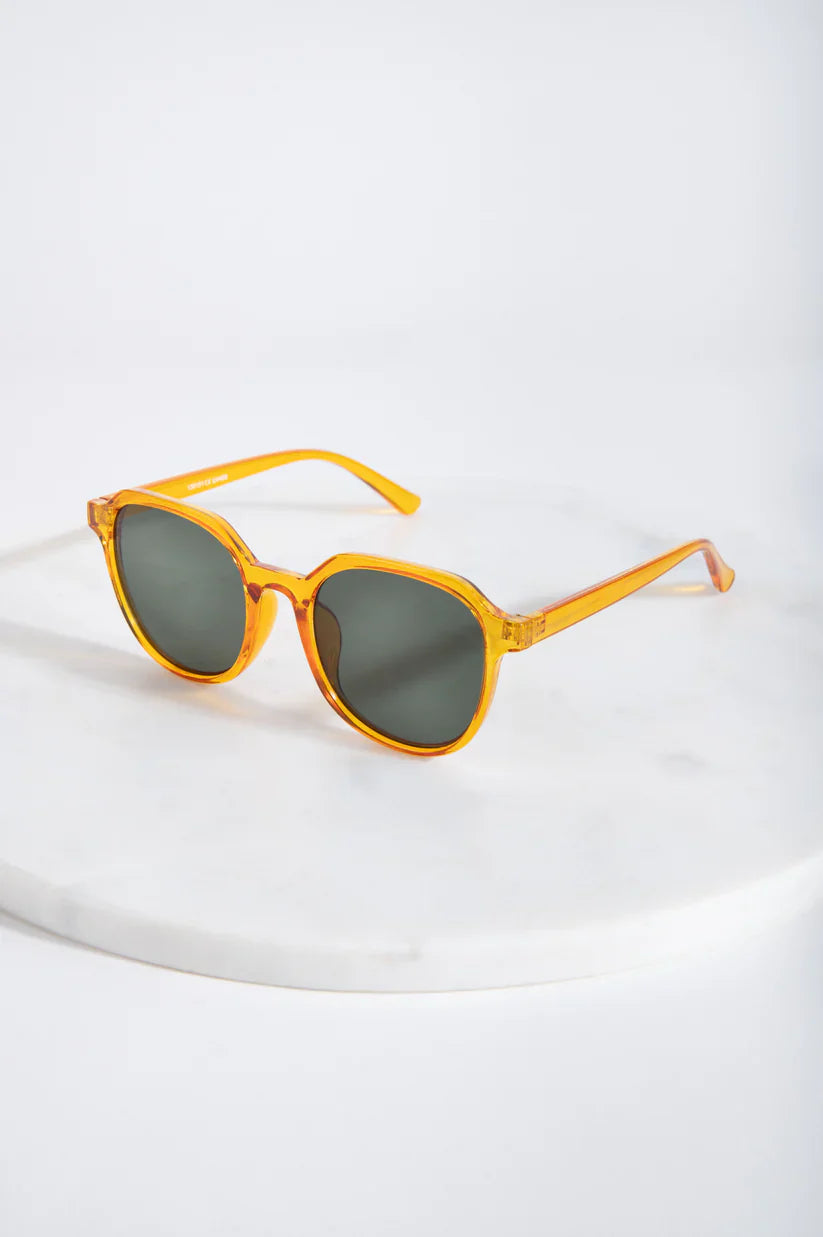 Chic oversized orange sunglasses with vintage-inspired silhouette and contemporary minimalist design appeal.