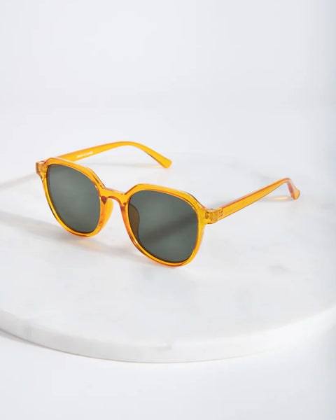 Chic oversized orange sunglasses with vintage-inspired silhouette and contemporary minimalist design appeal.