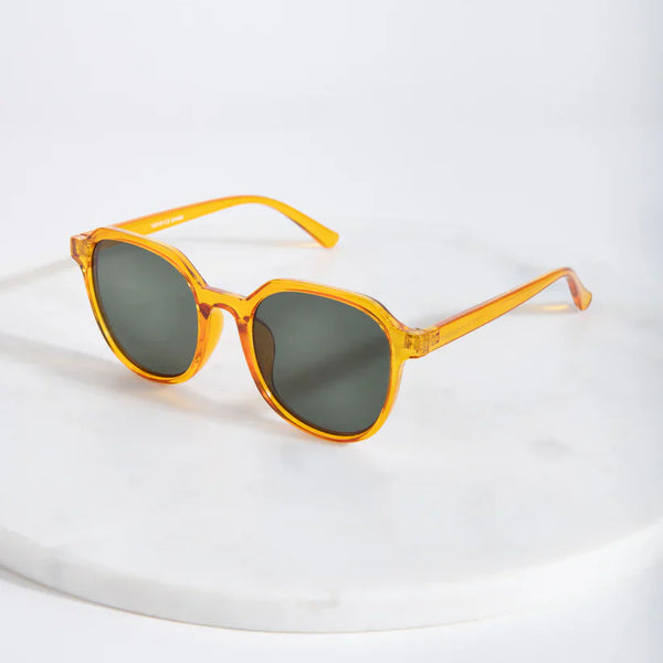 Chic oversized orange sunglasses with vintage-inspired silhouette and contemporary minimalist design appeal.