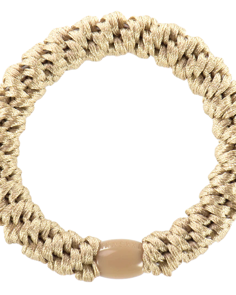 Artisan-inspired woven smooth hair tie with textured braid pattern and earthy green tones for laid-back fashion looks.