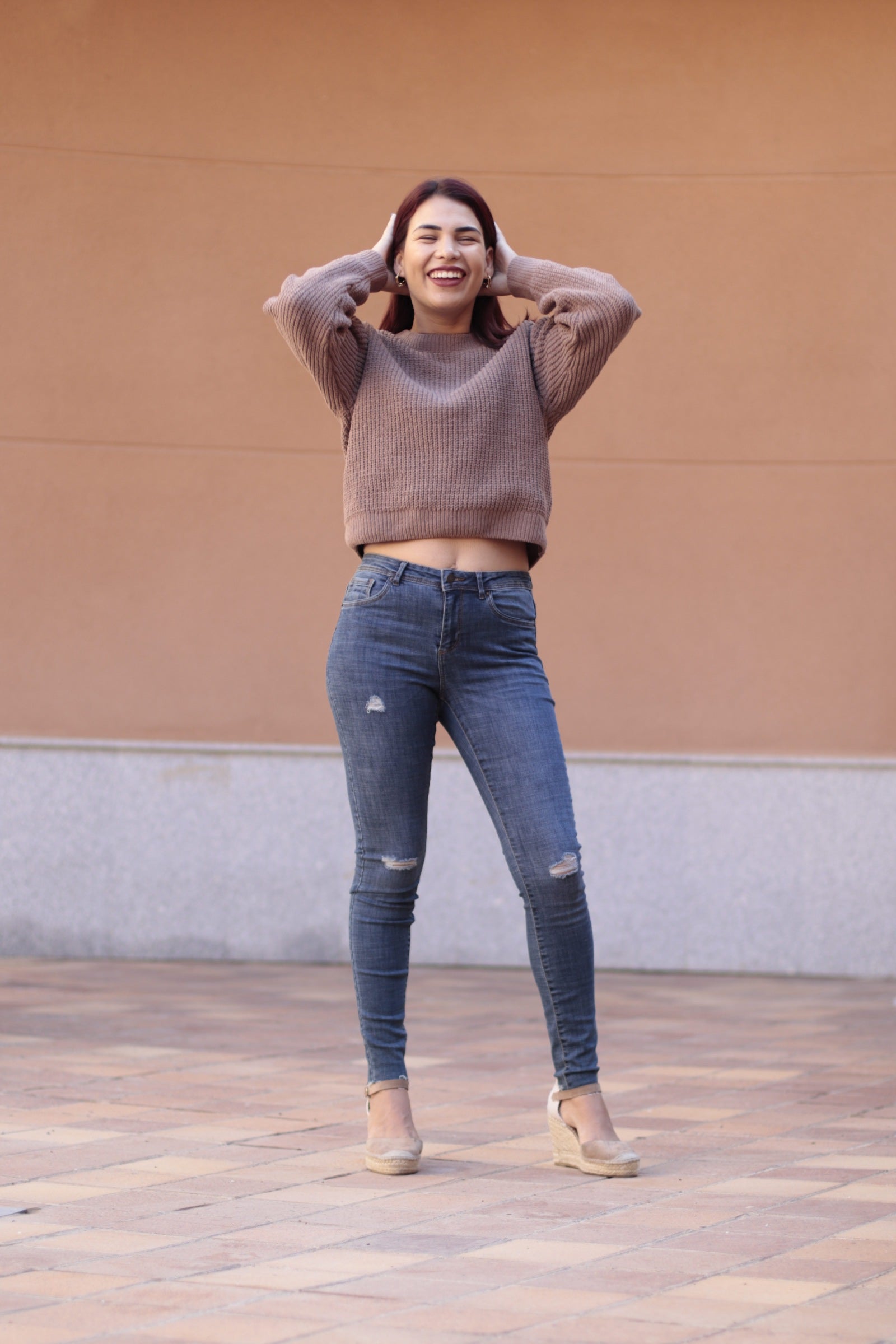 Slim-fit ripped jeans for women featuring soft blue denim, tapered ankle cut, and flattering everyday fit.