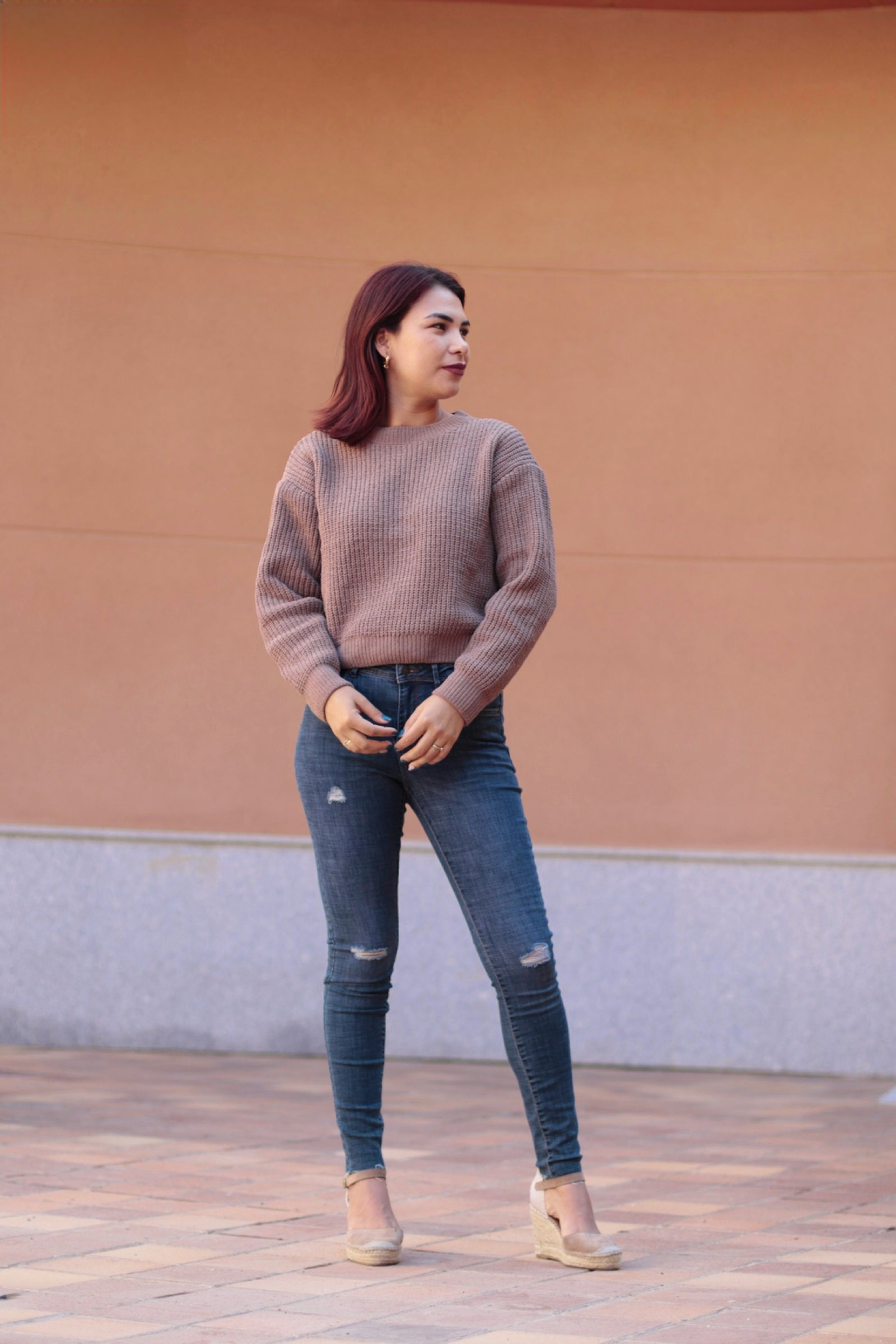Stretch skinny jeans for women in vintage-inspired blue denim with distressed knee details and flattering tailored silhouette.
