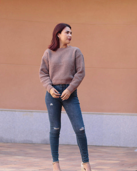 Stretch skinny jeans for women in vintage-inspired blue denim with distressed knee details and flattering tailored silhouette.