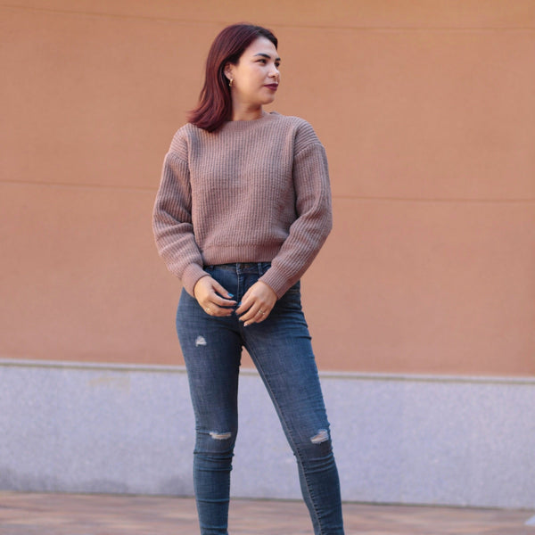 Stretch skinny jeans for women in vintage-inspired blue denim with distressed knee details and flattering tailored silhouette.