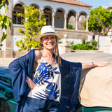 Women's resort-inspired camisole with striking blue tropical foliage print for coastal and vacation wardrobes.