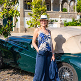 Women's tropical leaf print camisole featuring bold cobalt blue botanical patterns on a soft ivory background.