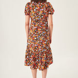 Multicolor floral dress featuring a flattering fitted waist and timeless feminine silhouette.