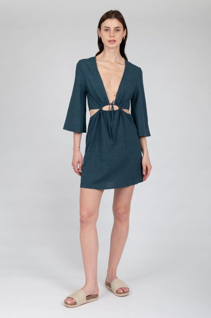 Women's lightweight vacation dress with modern cut-out waist styling.