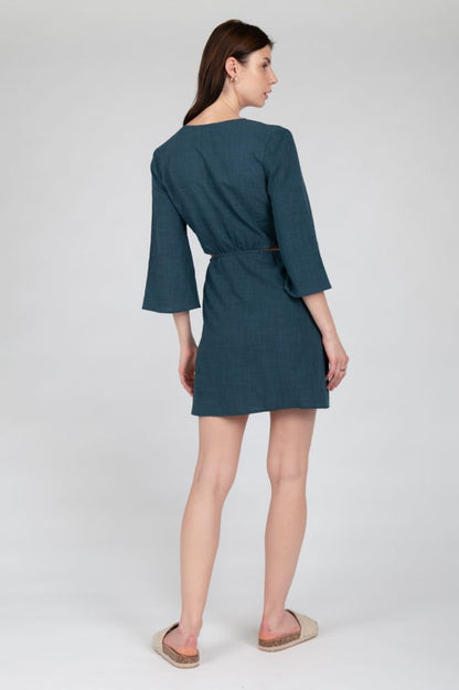 Trendy teal mini dress designed for summer events and resort styling.