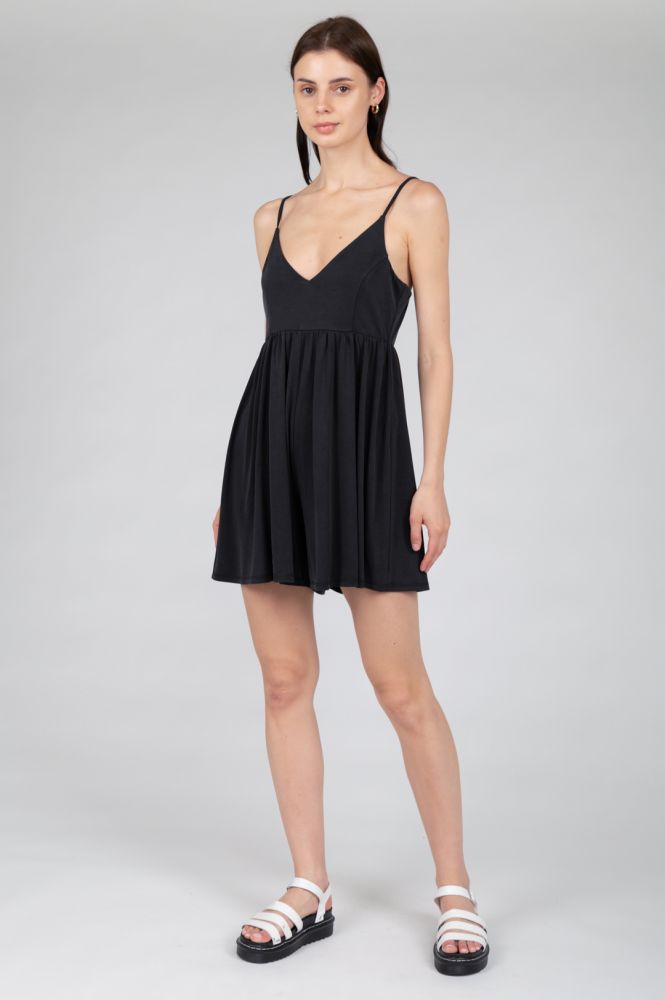 Black cami dress featuring a flattering V-neck and relaxed A-line silhouette.